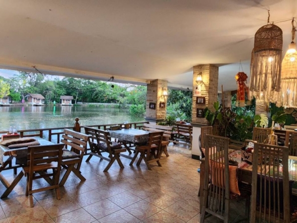 A large fishing park with restaurant for sale in Saraphi
