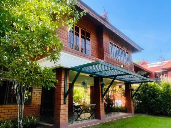 Applied Thai style house for sale. Built with golden teak behind the house next to the lake In a quality project